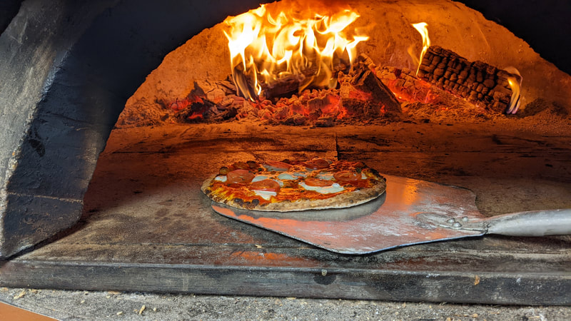 Come try out our wood fire pizza!!
